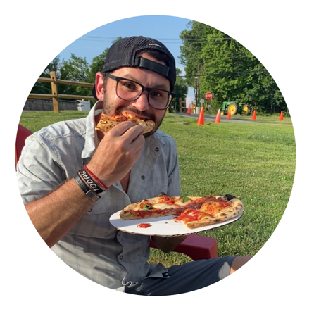 The author, Cody Jett, eating pizza.