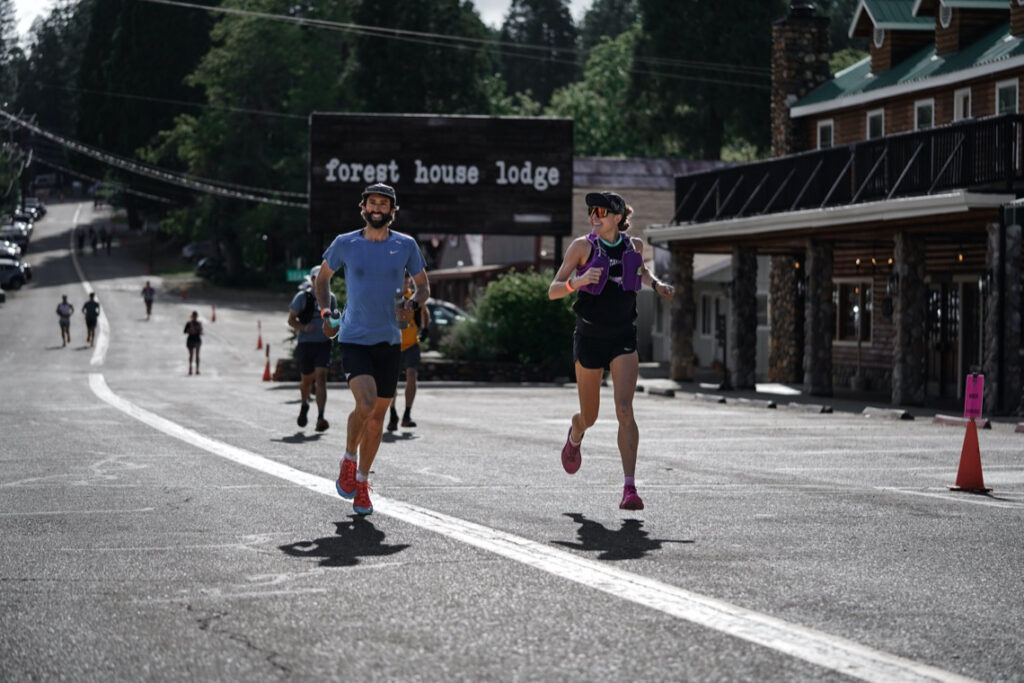 Tyler Green and Katie Asmuth running down Cal Street during the Western States Training Camp