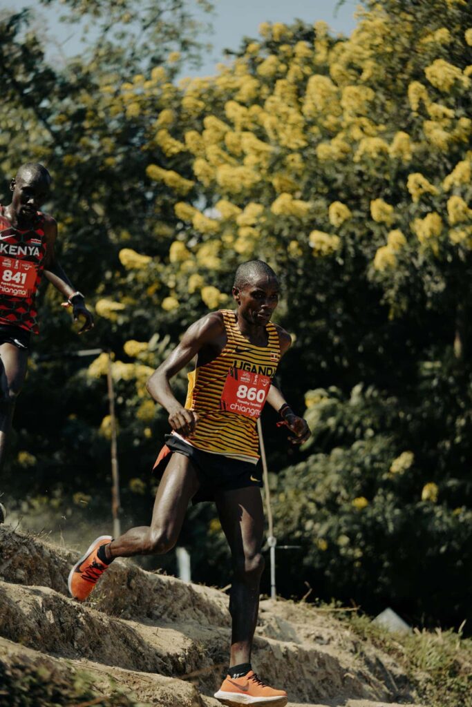 Patrick Kipngeno chases Timothy Toroitich on the downhill, they would go on to finish 2nd and 3rd respectively. 