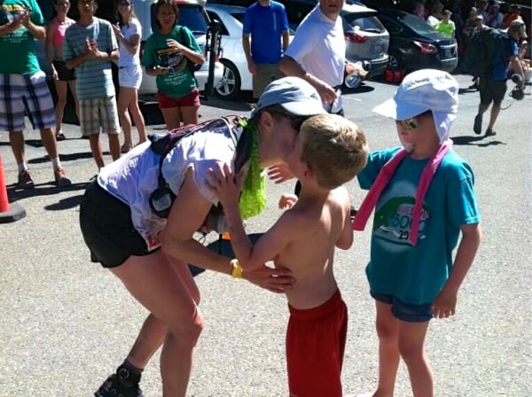 Pam Smith gives her kids a kiss during the 2013 WSER. 