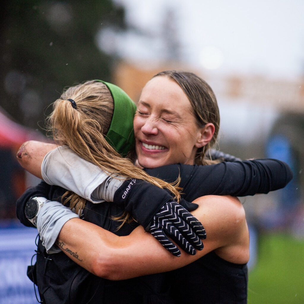 Meg Morgan and Katelyn McDaniel hug after the 50km at Gorge Waterfalls 50km