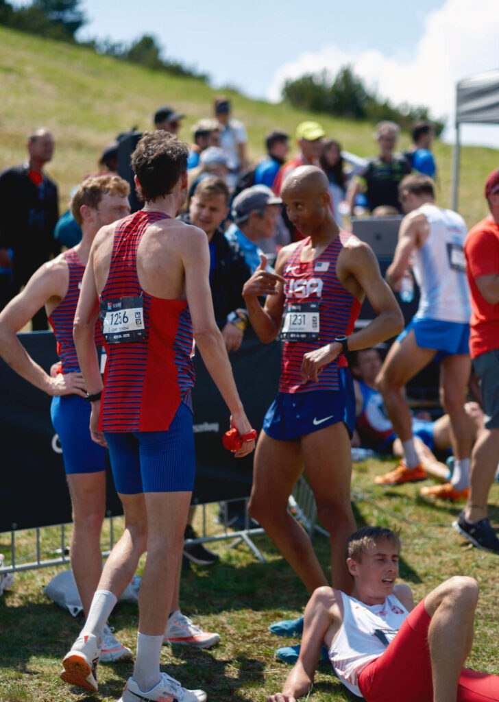 Team USA's Joe Gray, Dan Curts and Liam Meirow huddle up after the finish. 