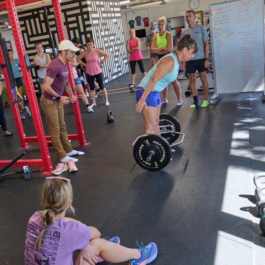 Runners learning about how to strength train. PC: Ruby Wyles 