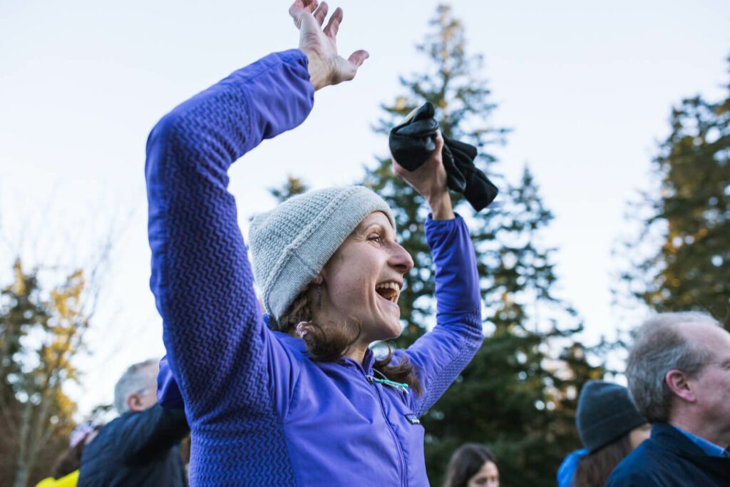 Krissy Moehl cheers on the start of the 30th Chuckanut 50km. 