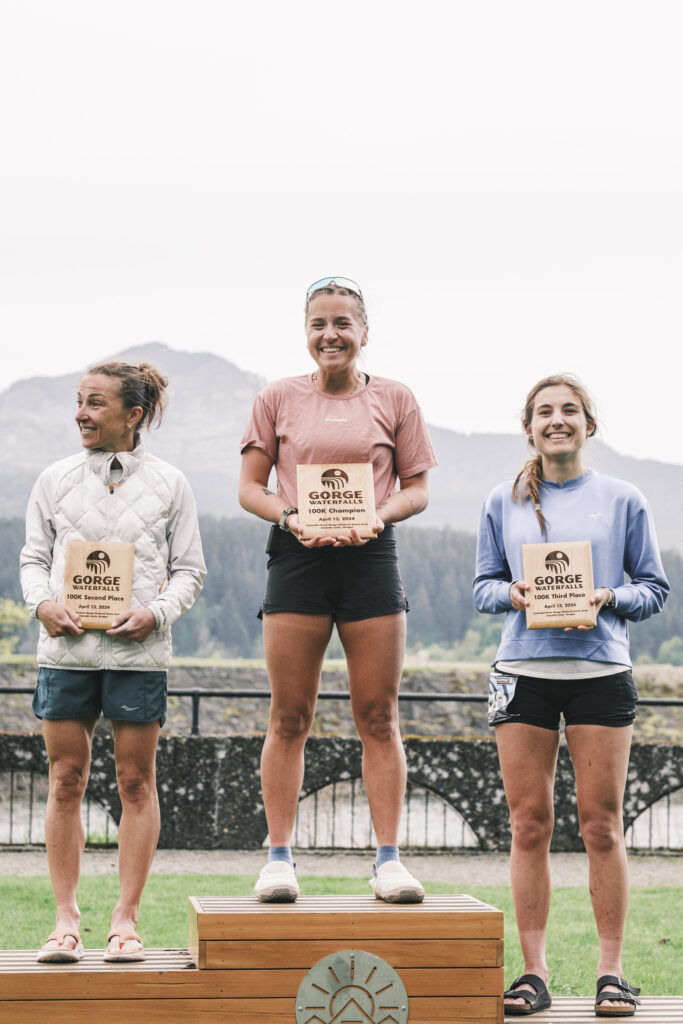 The 2024 Women's 100km podium at the Gorge Waterfalls.